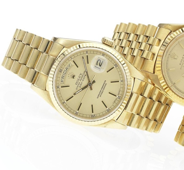 Rolex. A fine 18ct gold automatic centre seconds calendar bracelet watch together with fitted box and papers