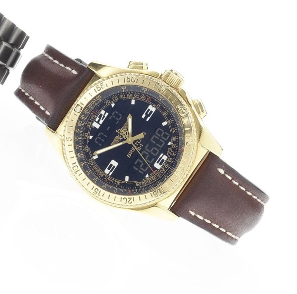 Breitling. A fine and unusual 18ct gold calendar alarm chronograph wristwatch with digital display and world time indication