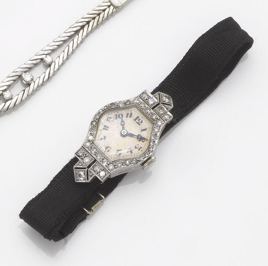 Vertex. A lady's platinum diamond set cocktail watch