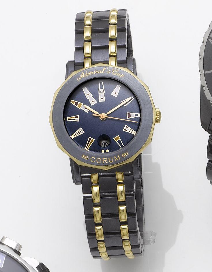 Corum. A lady's blued stainless steel and gold centre calendar bracelet watch together with fitted presentation box and papers