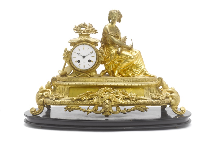 A late 19th century French ormolu figural mantel clock