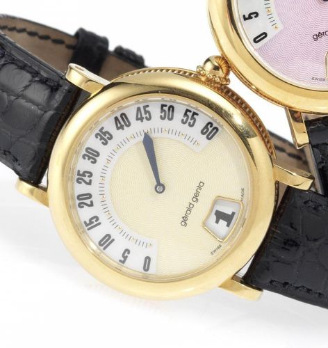 Gerald Genta. An 18ct gold automatic jump hour wristwatch together with fitted presentation box