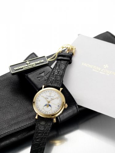 Vacheron Constantin. A fine 18ct gold triple calendar wristwatch with phases of the moon, together with swing tag, Certificate, wallet and outer card case
