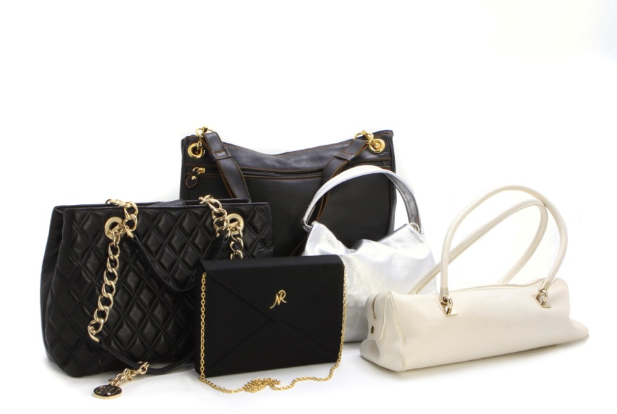 Two Kate Spade purses and a Walter Steiger purse
