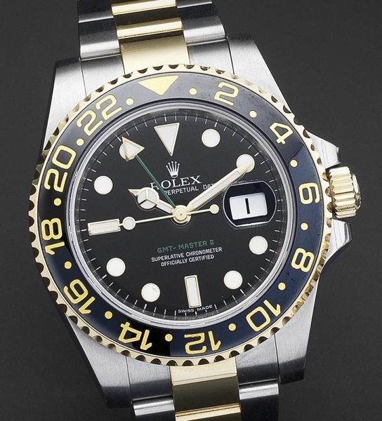 Rolex. A fine steel and gold automatic calendar bracelet watch with dual time zone indication GMT-Master Ref:116713, Serial No.V011***, Circa 2008