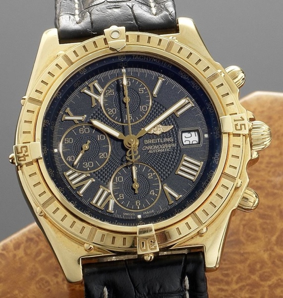 Breitling. An 18ct gold automatic chronograph wristwatch together with box and papers Crosswind Cronograph, Ref:K13055 1312, Sold 16th of December 2000