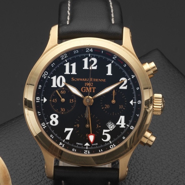 Schwarz Etienne. An 18ct gold automatic dual timezone chronograph wristwatch