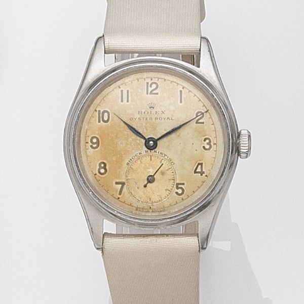 Rolex. A stainless steel manual wind wristwatch