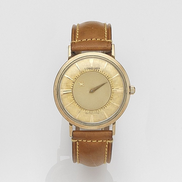 Longines. A gold plated automatic mystery hour wristwatch
