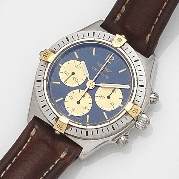 Breitling. A stainless steel and gold manual wind chronograph wristwatch