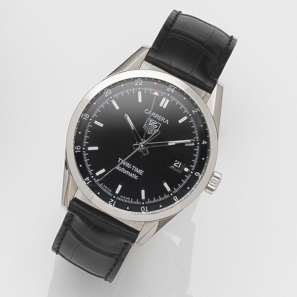 TAG Heuer. A stainless steel automatic calendar second timezone wristwatch with box and papers