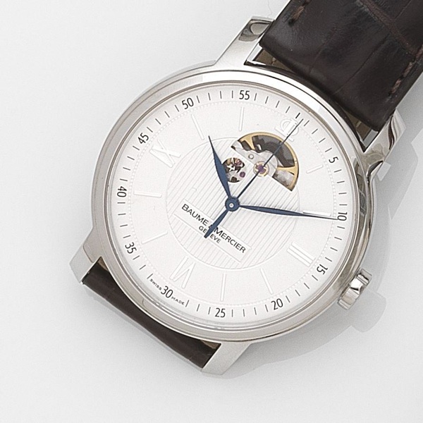 Baume Mercier. A stainless steel automatic centre seconds wristwatch together with box and papers
