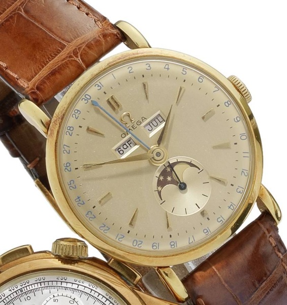 Omega. An 18ct gold manual wind triple calendar wristwatch with phases of the moon