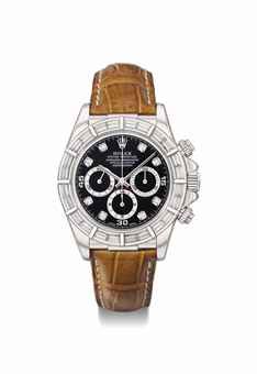 Rolex. A very rare and attractive 18K white gold and diamond-set automatic chronograph wristwatch