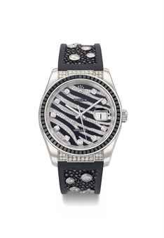 Rolex. An 18K white gold, black sapphire and diamond set automatic wristwatch with sweep centre seconds and date