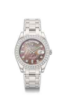 Rolex. A very fine platinum and diamond-set automatic wristwatch with sweep centre seconds, day, date, mother-of-pearl dial and bracelet