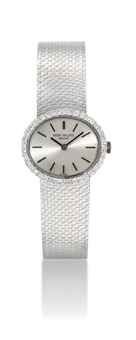 PATEK PHILIPPE. A LADY'S 18K WHITE GOLD AND DIAMOND-SET OVAL BRACELET WATCH