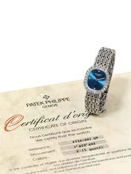 PATEK PHILIPPE. A LADY'S FINE 18K WHITE GOLD AND DIAMOND-SET CUSHION-SHAPED BRACELET WATCH WITH ORIGINAL CERTIFICATE