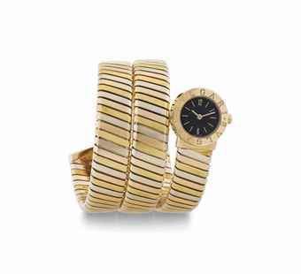 Bulgari. A Lady's 18k Tri-Color Gold Coiling Serpent Bracelet Watch
