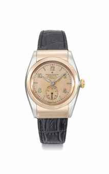 Rolex. A fine and rare stainless steel and 18K pink gold automatic bubble back wristwatch with pink dial, hooded lugs and box