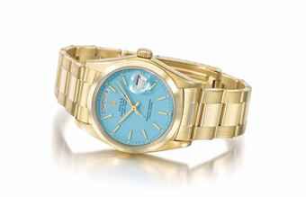 Rolex. A fine, attractive and rare 18k yellow gold automatic wristwatch with sweep centre seconds, day, date, bracelet and turquoise lacquered dial