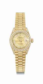Rolex. An attractive and elegant 18K gold and diamond wristwatch with date and bracelet