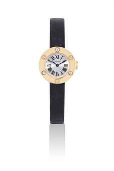 CARTIER. A LADY'S 18K GOLD AND DIAMOND-SET WRISTWATCH