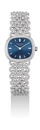 PATEK PHILIPPE. A LADY'S FINE 18K WHITE GOLD CUSHION-SHAPED BRACELET WATCH