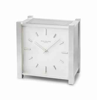 Patek Philippe. A fine and rare rhodium-plated brass square electro-mechanical and solar-powered desk timepiece
