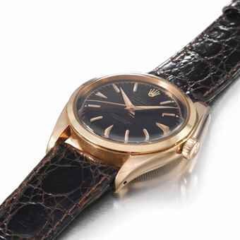 Rolex. A very fine and extremely rare 18K pink gold automatic wristwatch with sweep centre seconds and black gloss dial