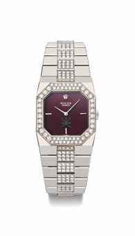 Rolex. A rare 18K white gold and diamond-set rectangular bracelet watch with maroon dial, made for the Sultanate of Oman