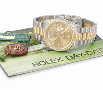 Rolex. A fine and very rare 18K white, yellow and pink gold automatic wristwatch with day, date, diamond-set champagne dial and bracelet