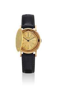 PIAGET. AN 18K GOLD COIN WRISTWATCH