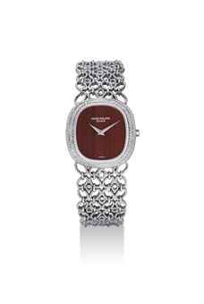 PATEK PHILIPPE. A FINE 18K WHITE GOLD CUSHION-SHAPED BRACELET WATCH WITH JASPER DIAL