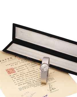 PATEK PHILIPPE. A LADY'S FINE 18K WHITE GOLD, DIAMOND AND RUBY-SET BRACELET WATCH WITH ORIGINAL CERTIFICATE AND BOX
