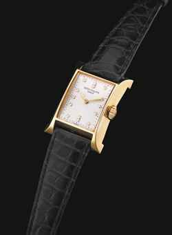 PATEK PHILIPPE. A LADY'S FINE 18K GOLD AND DIAMOND-SET LIMITED EDITION RECTANGULAR WRISTWATCH, MADE TO COMMEMORATE THE OPENING OF PATEK PHILIPPE'S WATCHMAKING CENTRE IN GENEVA IN 1997