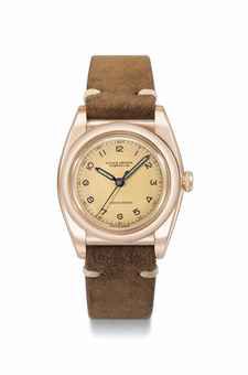 Rolex. A rare 10K pink gold and stainless steel automatic bubble back wristwatch with sweep centre seconds