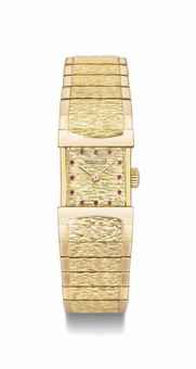 Patek Philippe. A fine, rare and unusual 18K gold and ruby-set bracelet watch