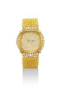 PATEK PHILIPPE. A LADY'S FINE AND RARE 18K GOLD AND DIAMOND-SET BRACELET WATCH