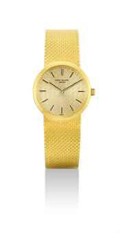 PATEK PHILIPPE. A LADY'S 18K GOLD BRACELET WATCH