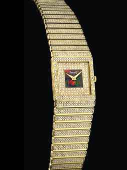 PIAGET. AN 18K GOLD AND DIAMOND-SET RECTANGULAR BRACELET WATCH WITH OPAL DIAL