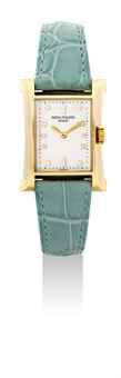 PATEK PHILIPPE. A LADY'S FINE 18K GOLD AND DIAMOND-SET LIMITED EDITION RECTANGULAR WRISTWATCH, MADE TO COMMEMORATE THE OPENING OF PATEK PHILIPPE'S WATCHMAKING CENTRE IN GENEVA IN 1997
