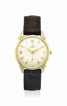 OMEGA. AN ATTRACTIVE 14K GOLD AUTOMATIC WRISTWATCH WITH HONEYCOMB DIAL