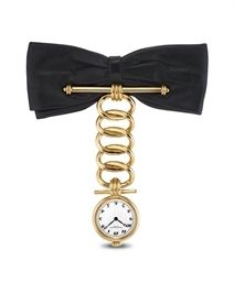 PATEK PHILIPPE. A LADY'S 18K GOLD BROOCH-WATCH