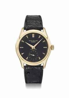Patek Philippe. A fine and very rare 18K gold wristwatch with black dial and luminous hands and numerals