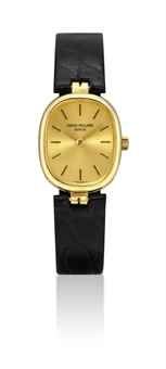 PATEK PHILIPPE. A LADY'S 18K GOLD CUSHION-SHAPED WRISTWATCH
