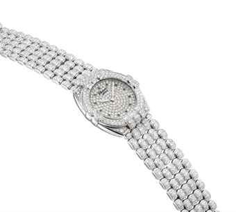 CHOPARD. AN 18K WHITE GOLD, DIAMOND AND EMERALD-SET TONNEAU-SHAPED WRISTWATCH WITH BRACELET