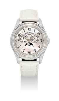 PATEK PHILIPPE. A LADY ’ S FINE AND ATTRACTIVE 18K WHITE GOLD AND DIAMOND-SET AUTOMATIC ANNUAL CALENDAR WRISTWATCH WITH SWEEP CENTRE SECONDS AND MOTHER-OF-PEARL DIAL