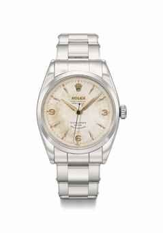 Rolex. A fine stainless steel automatic wristwatch with sweep centre seconds, white honeycomb dial, pink gold numerals and hands, made for the Canadian market