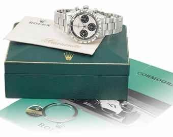 Rolex. A very fine and rare stainless steel chronograph wristwatch with Paul Newman dial, bracelet, green sticker, second bezel, blank Guarantee, brochure and box